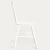 A white chair is shown in profile against a plain white background. Produktbild-Vorschau