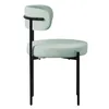 A single chair with a light green seat and backrest, and black metal legs, shown from the side against a white background. Náhled obrázku produktu