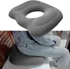 A person is sitting on a chair with an inflatable ring cushion placed on the seat. Náhled obrázku produktu