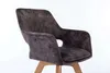A close-up studio shot of a single upholstered chair with wooden legs against a white background. Produktbild-Vorschau