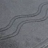 A close-up view of a grey towel with a wavy pattern. Produktbild-Vorschau