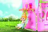 A fairy doll is swinging on a swing attached to a pink playhouse. Produktbild-Vorschau