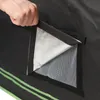 A hand is shown opening a vent flap on a grow tent. Náhled obrázku produktu