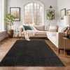 A living room scene with a sectional sofa, a rug, and decor.