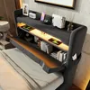 A modern bedroom with a bed featuring a storage headboard with built-in lighting and charging ports. Podgląd zdjęcia produktu