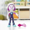 A Ghost-Spider action figure is displayed on a white surface with a blurred background of shelves and furniture. Anteprima dell’immagine prodotto
