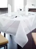 A white tablecloth with a chevron pattern is set on a dining table with place settings. Produktbild-Vorschau