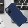 A dark blue phone case is placed diagonally on a laptop keyboard. Podgląd zdjęcia produktu