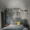 A bedroom scene with a bed, headboard, pillows, and a radiator. Produktbild-Vorschau