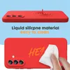 A red phone case is shown with text indicating it is made of liquid silicone and is easy to clean. A hand is shown wiping the case with a wet wipe. Náhled obrázku produktu