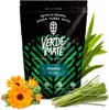 A bag of Verde Mate Green Fitness Yerba Mate tea is shown, surrounded by fresh herbs and flowers. Produktbild-Vorschau