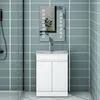 A white bathroom vanity with a sink and faucet, set against a tiled wall. Produktbild-Vorschau