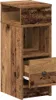 A single, tall, narrow nightstand with a rustic wood-like finish, featuring one open shelf at the top, a closed shelf below it, and a drawer that is partially open at the bottom. The drawer has a dark, round knob. Náhled obrázku produktu