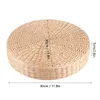 A round, woven pouf or cushion is shown from a top-down perspective against a white background. Dimensions are indicated with lines and text. Voir les images du produit
