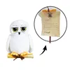 A plush toy owl sitting on a scroll, with a close-up of a letter from Hogwarts. Produktbild-Vorschau