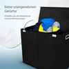 A black laundry basket with clothes inside, with text overlay describing a feature. Produktbild-Vorschau