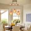 A dining room with a wooden table, chairs, and a pendant light fixture. Produktbild-Vorschau