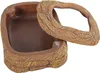 A reptile food bowl with a textured, rock-like exterior and a removable lid. Produktbild-Vorschau