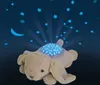 A plush bunny toy projecting stars onto a dark blue background with a crescent moon. Anteprima dell’immagine prodotto