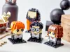 Three LEGO BrickHeadz figures of Harry Potter characters are displayed on a table. Produktbild-Vorschau