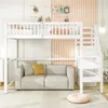 A white loft bed with stairs and a sofa underneath, set in a room with decorative elements. Náhľad obrázku produktu