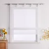 A white sheer Roman blind is shown hanging on a window, with a small vase of sunflowers on a wooden dresser to the left. Produktbild-Vorschau