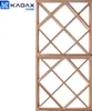 A wooden wine rack with a grid pattern, shown against a white background. Voir les images du produit