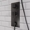 Schwarzes Bedienpanel mit Armatur auf Duschrückwand in weißer Fliesenoptik Produktbild-Vorschau