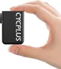A hand holding a small black electronic device. Náhľad obrázku produktu