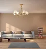 A living room scene with a sofa, coffee table, rug, and a storage unit. Podgląd zdjęcia produktu