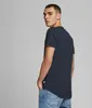A man wearing a navy blue t-shirt and blue jeans, shown from the back and side. Produktbild-Vorschau