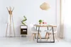 A dining room with a table and chairs, a coat rack, and a wine rack. Produktbild-Vorschau