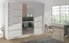 A modern white wardrobe with mirrored doors is shown in a well-lit room with a large window. Náhľad obrázku produktu