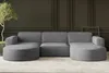 A modern U-shaped sectional sofa in a dark gray fabric with a ribbed texture, set against a dark paneled wall. Produktbild-Vorschau