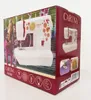 The image shows the packaging for a Carina Junior sewing machine. The box is red and features a prominent image of the sewing machine itself, along with other graphics and text. Produktbild-Vorschau