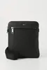 A black BOSS crossbody bag is shown against a white background. Voir les images du produit