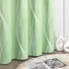 A close-up view of a green curtain with a white wavy pattern, placed in a room with decorative vases and a rug. Produktbild-Vorschau
