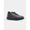 A black Lotto sneaker with a red stripe detail is shown against a plain light gray background. Podgląd zdjęcia produktu