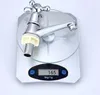 A chrome faucet is placed on a digital scale. Produktbild-Vorschau