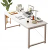A white computer desk with various items on it, including a laptop, books, a lamp, and a plant. Podgląd zdjęcia produktu