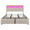 A beige upholstered bed frame with a slatted base and a headboard with integrated LED lighting. Produktbild-Vorschau