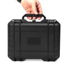 A hand holding a black hard case. Produktbild-Vorschau