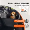 A dog sitting in a car seat booster. Náhľad obrázku produktu