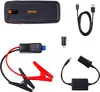 A flat lay of a car jump starter kit and its accessories against a white background. Náhled obrázku produktu
