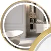 A luxurious bathroom scene reflected in a round, gold-framed mirror with integrated LED lighting. Produktbild-Vorschau