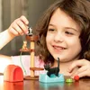 A young girl plays with a toy cat set, including a cat tree, toy cats, and accessories. Náhľad obrázku produktu
