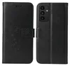 A black flip cover phone case with a floral design, shown open and closed. Produktbild-Vorschau