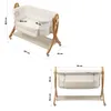 Two views of a baby bassinet with dimensions indicated. Náhled obrázku produktu