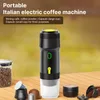 A portable coffee machine is displayed on a wooden table with coffee beans and capsules. Náhľad obrázku produktu