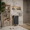 A modern bathroom with a wooden shelf unit, a laundry basket, and a shower. Podgląd zdjęcia produktu